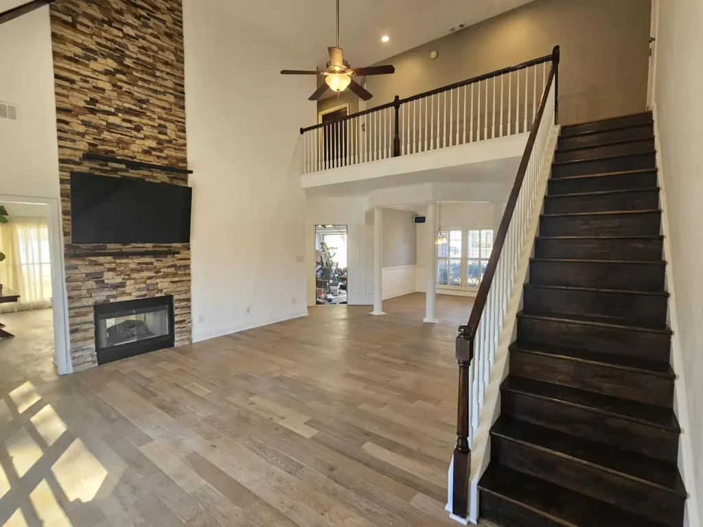Living room with fireplace and staircase